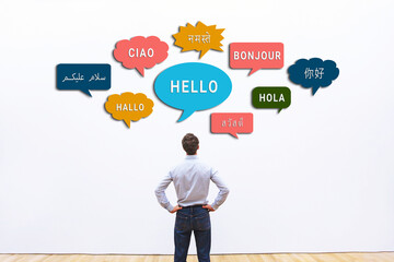 business man looking at Hello word in different languages, learn foreign language for professional...
