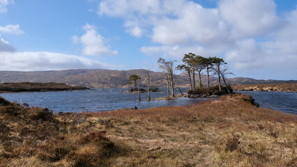 Stunning rugged and mountainous landscape with Lewisian gneiss precambrian metamorphic rock on Loch...