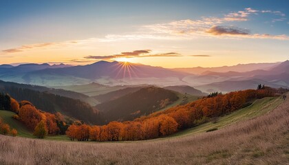 mountains at sunset in slovakia landscape with mountain hills orange trees and grass in fall colorful sky with golden sunbeams panorama