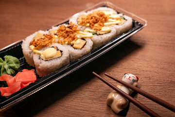 Tamago and spicy mayo urumaki sushi, wasabi, gari pickled ginger, takeaway