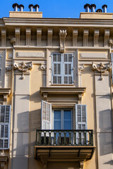 Architectural fragments of the facades of ancient houses in Nice: beautiful windows, balconies,...
