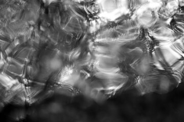 Abstract reflection of a stream caused by waves.