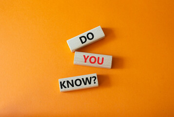 Do you know symbol. Concept word Do you know on wooden cubes. Beautiful orange background. Business...