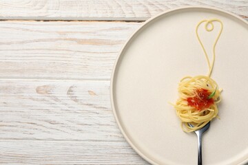 Heart made with spaghetti and fork on white wooden table, top view. Space for text