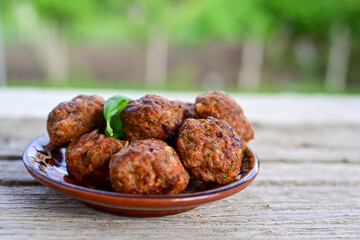 Home made Fried  pork meatballs  outdoor on wooden rustic background