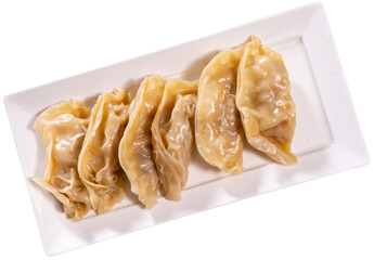 Delicious japanese gyoza dumplings stuffed with pork served on plate. Isolated over white background