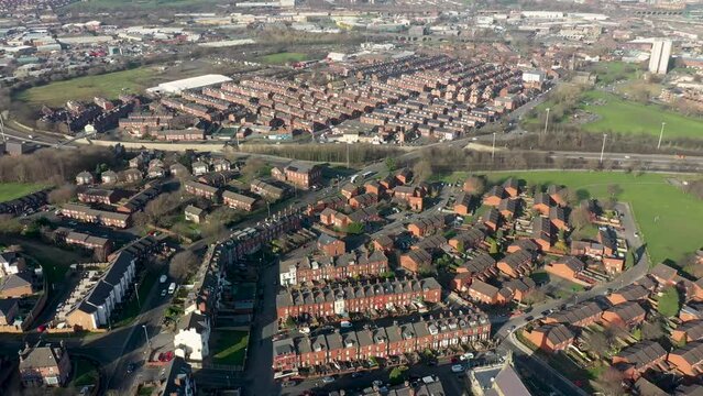 Aerial footage of the town known as Holbeck in Leeds West Yorkshire UK, showing rows of houses in a typical British housing estate taken in the wintertime near the M621 motorway.