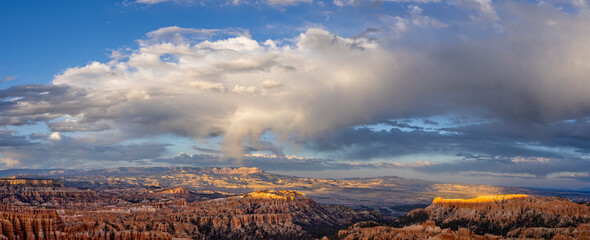 Panoramic view of Bryce Canyon amphitheatre in golden light at sunset from viewpoint in Bryce...