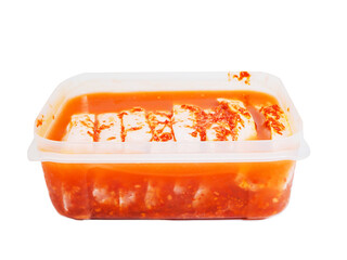 Pork chops in red Asian style marinade with chilly pepper in plastic container. Fine pork meat for...