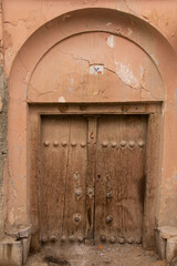 The wooden door of an old house in Isfahan, Iran