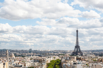 Naklejka premium City View of Paris, France from the Arc de Triomphe on a Sunny Day with Beautiful Clouds
