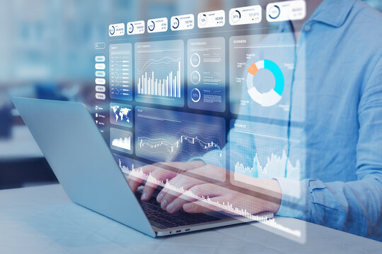 Analyst working with Financial Report and Business Analytics Dashboard on laptop computer to analyze Financial Data with KPI and Metrics. Investment, Corporate Finance, Operations, Sales, Strategy.