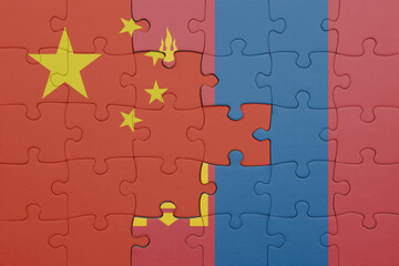 puzzle with the colourful national flag of mongolia and flag of china .