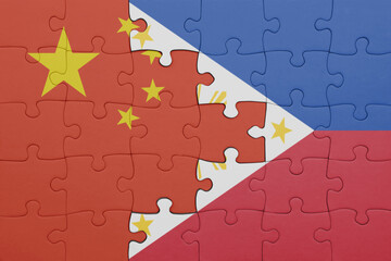 puzzle with the colourful national flag of philippines and flag of china .