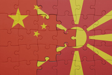 puzzle with the colourful national flag of macedonia and flag of china .