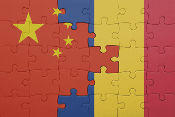 puzzle with the colourful national flag of romania and flag of china .