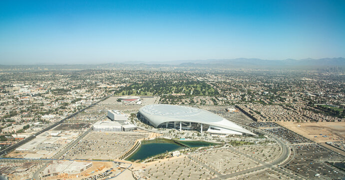 Los Angeles, California/USA -  Aerial View of SoFi Stadium home of the LA Rams and the LA Chargers with the LA Coliseum in the background as well as parking lots