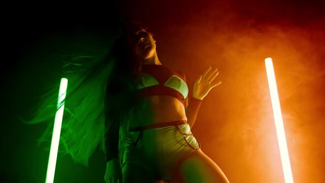 Swag performance of sexy woman, girl dances erotic twerk, sexual hips movements, shaking body