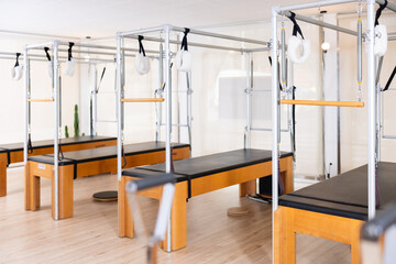 Reformer pilates studio machine for fitness workouts in gym