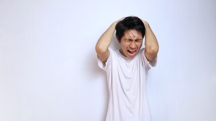 young asian man in white shirt with expression dizzy, stressed, depressed, mentally damaged, lost,...