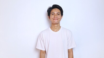 young asian man in white shirt smiling expression