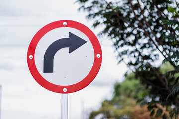 Traffic sign indicating right turn, rules of civility and mobility