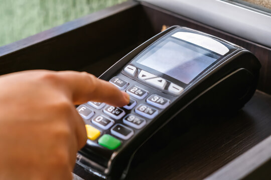 Person uses dataphone to pay for services, electronic purchases and online payments