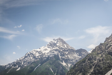 Mountain panorama landscape in the mountains of Tajikistan on a sunny summer day, view of mountain ranges in the highlands