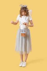 Tooth Fairy with wand and basket on yellow background
