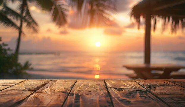 Blurred background of an outdoor wooden table with sunset and palm trees in the foreground, for product display montage or backdrop design.