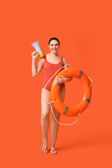 Female lifeguard with ring buoy and megaphone on orange background