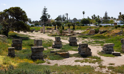 Scenic view of ruins of ancient Carthage Punic Ports with remains of stone structures and dry docks...