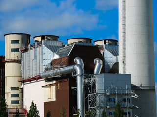 Obraz premium Municipal waste incinerator. Industrial theme for the environment. Waste-to-energy facility, outdoor technology facility in the capital city of Prague, Europe. Background.