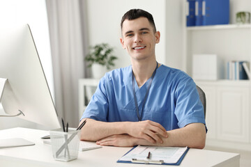 Portrait of smiling medical assistant in office