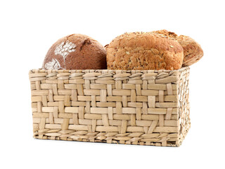 Basket with different types of fresh bread isolated on white