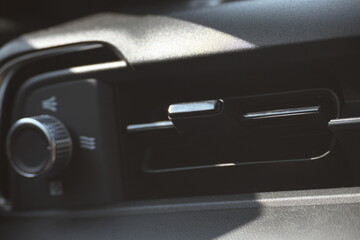 interior view of car with black leather, closeup car air conditional vents