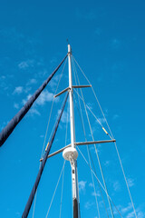 White Ship's Mast Under Fair Blue  Skies.