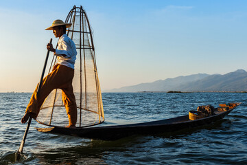 Myanmar travel attraction landmark - Traditional Burmese fisherman at Inle lake, Myanmar famous for...