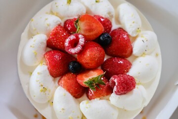 A Japanese-style strawberry shortcake with fresh cream, strawberries, raspberries and blueberries in a white cake box from Maki’s Patisserie in Sydney, Australia