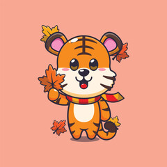 Cute tiger holding autumn leaf