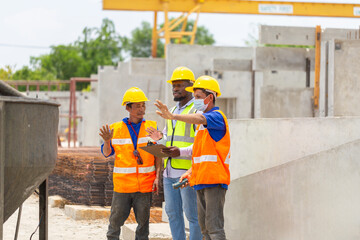 Construction workers at work, Foreman and worker team discussing at precast concrete factory site