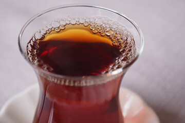 Traditional turkish tea on white table .