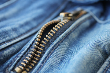 Closeup of metal zipper on denim jeans, 