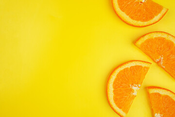Summer fruit background concept, orange slice on yellow background