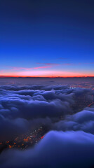 View of the sky from above with the sun rising over the horizon