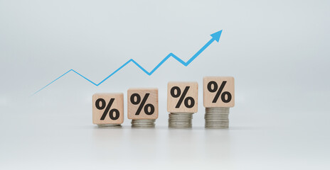 Interest rate concept Wooden block with percentage sign and increasing arrow financial growth Interest rates increase, sales prices and tax concepts increase.