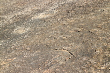 Details of sand stone texture, closeup shot of rock surface with vignette at cover and bright spot...