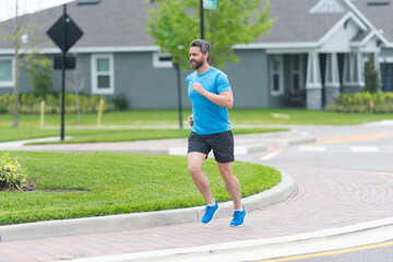 Man sportsman running for exercise outdoor. In a morning sport workout jogger run. Hispanic...