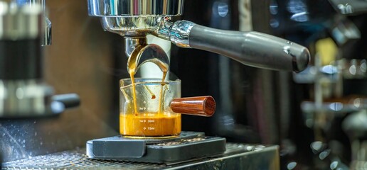 Barista making coffee with an espresso machine