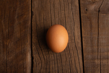 single egg on wooden table